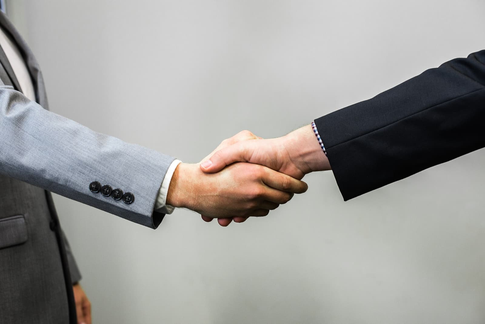 Two professionals shaking hands